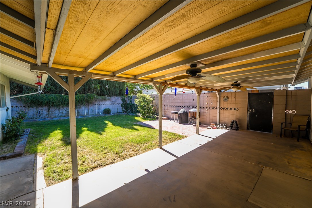 1324 Appaloosa Road Boulder City, NV 89005 - Photo 36 of 42 An inviting backyard oasis features a covered patio perfect for al fresco dining and a private yard for leisure.