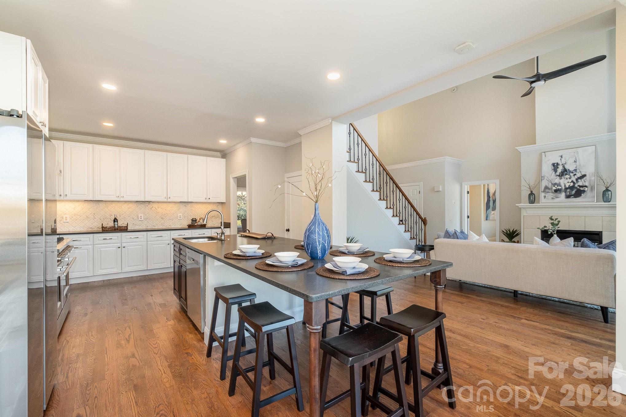 20105 Chapel Point Lane Cornelius, NC 28031 - Photo 16 of 39 a kitchen with a table and chairs in it