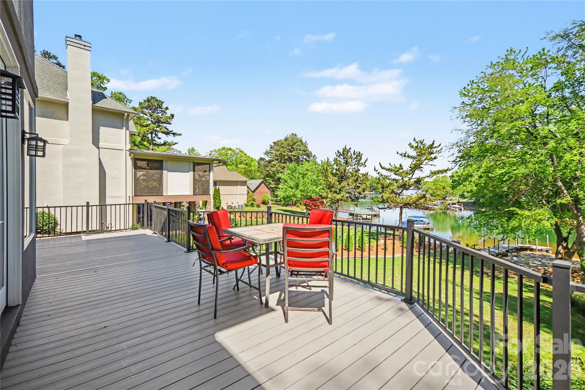20105 Chapel Point Lane Cornelius, NC 28031 - Photo 2 of 39 a roof deck with table and chairs and wooden floor
