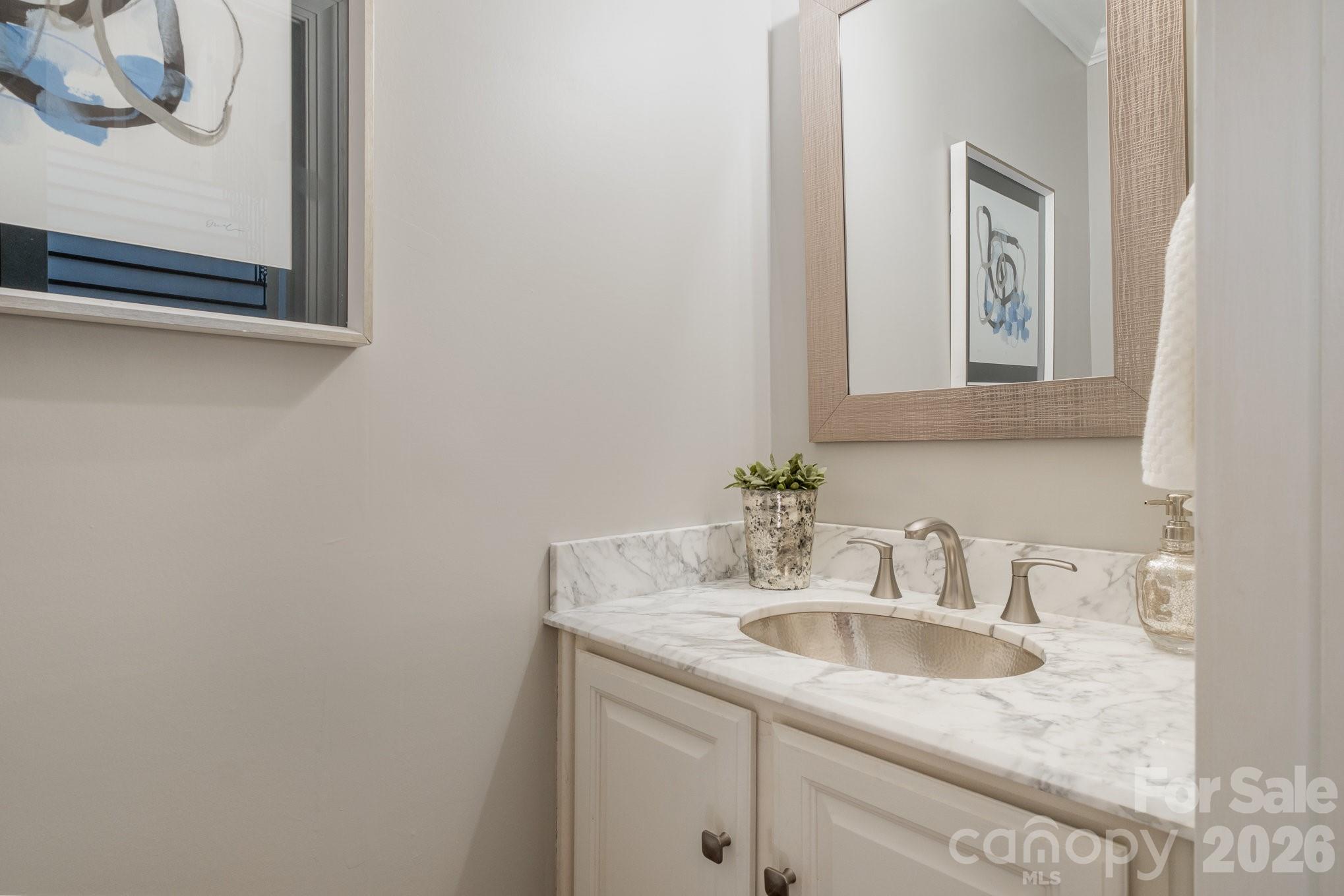 20105 Chapel Point Lane Cornelius, NC 28031 - Photo 21 of 39 a bathroom with a sink and a mirror