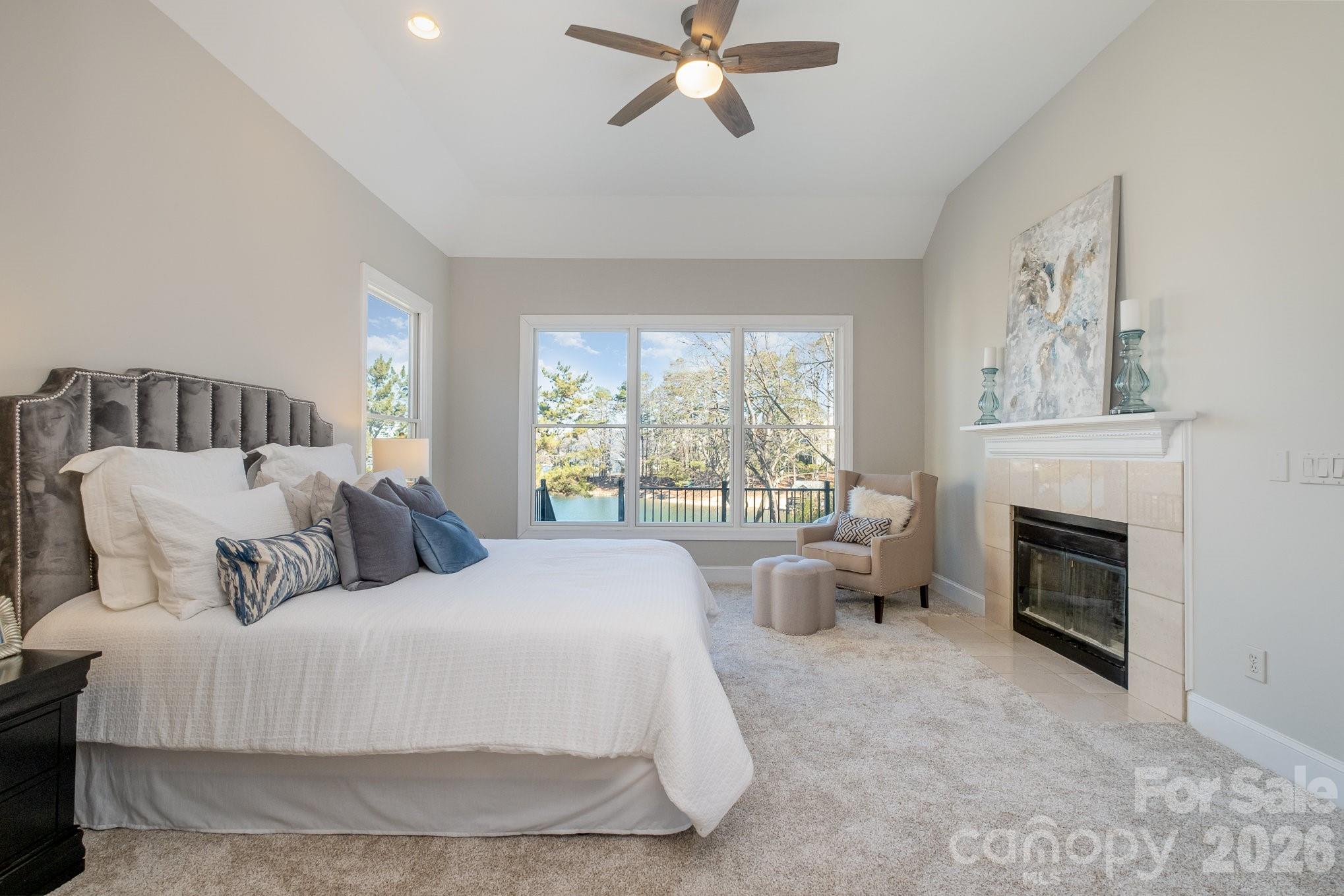 20105 Chapel Point Lane Cornelius, NC 28031 - Photo 24 of 39 a bed room with a bed and a fireplace