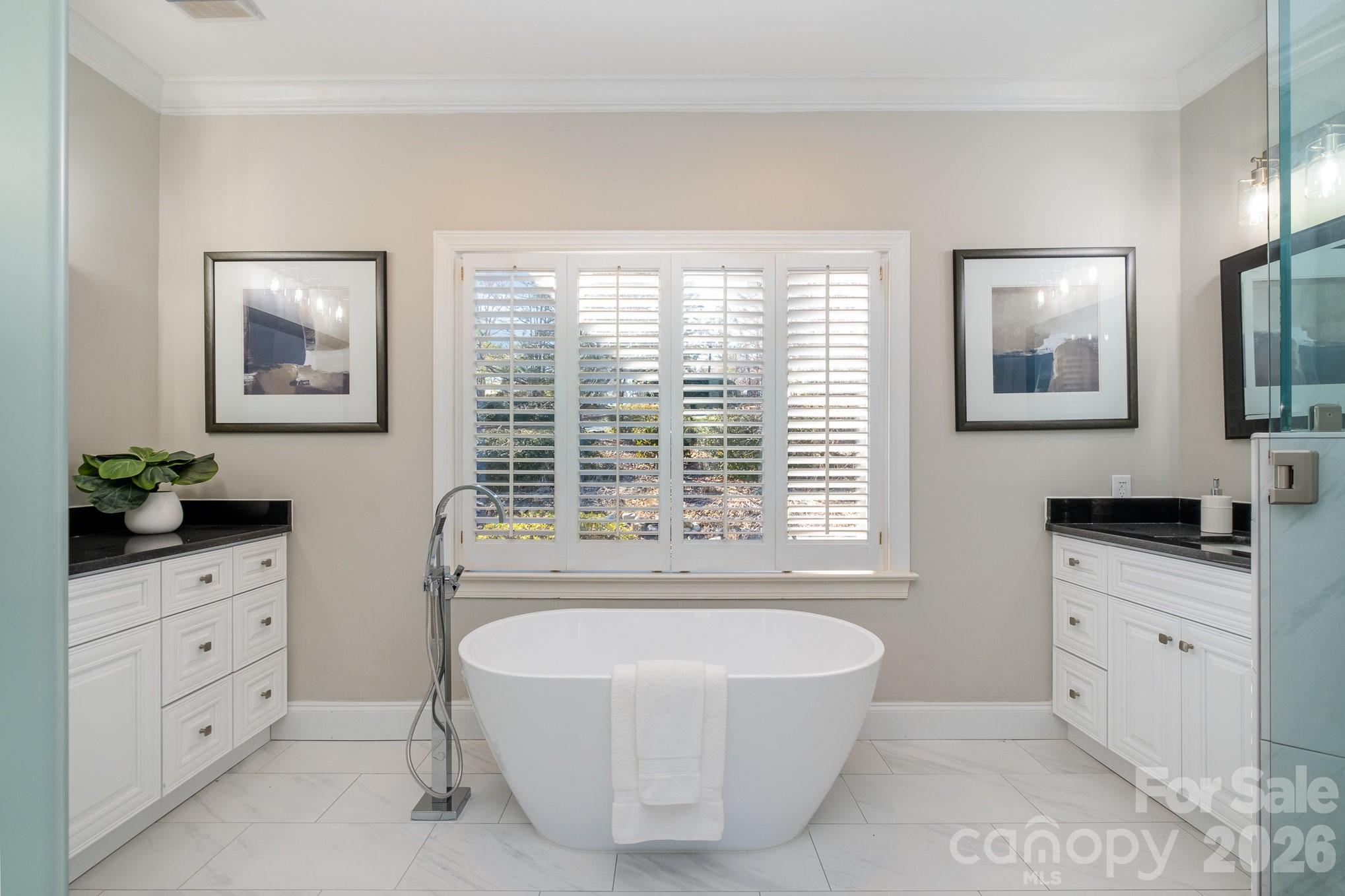 20105 Chapel Point Lane Cornelius, NC 28031 - Photo 26 of 39 a spacious bathroom with double vanity a window a double vanity and a mirror