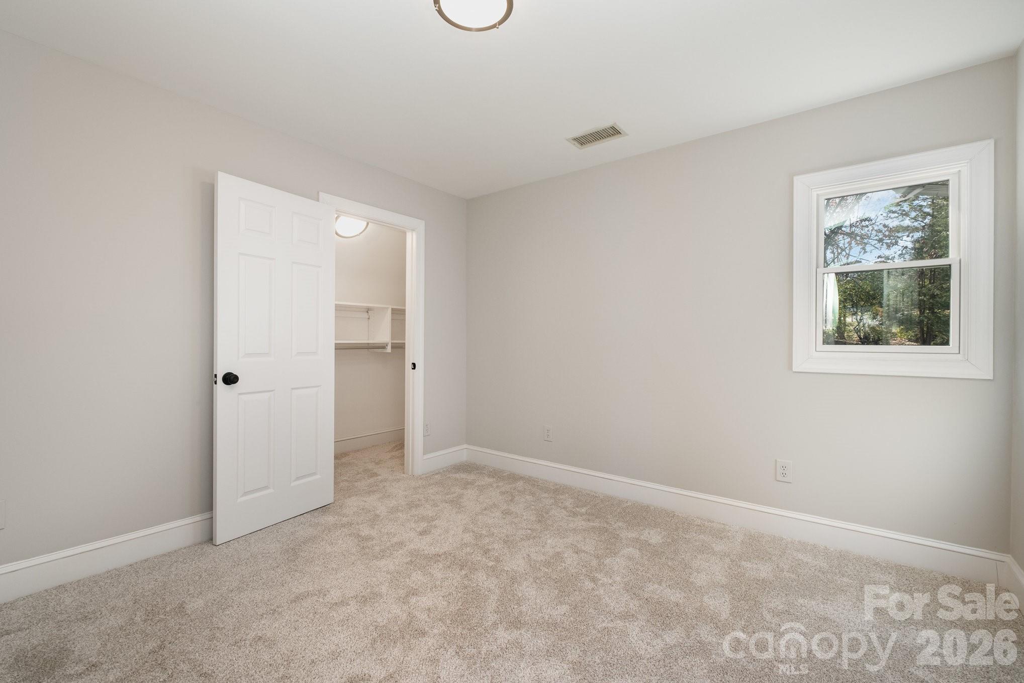 20105 Chapel Point Lane Cornelius, NC 28031 - Photo 27 of 39 an empty room with a window and a bathroom