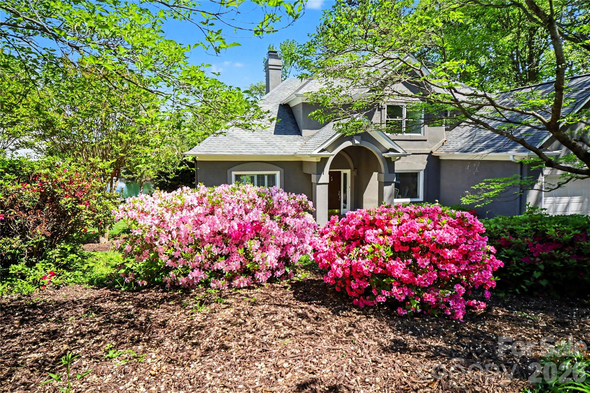 20105 Chapel Point Lane Cornelius, NC 28031 - Photo 38 of 39 a front view of house and lot of flowers and trees