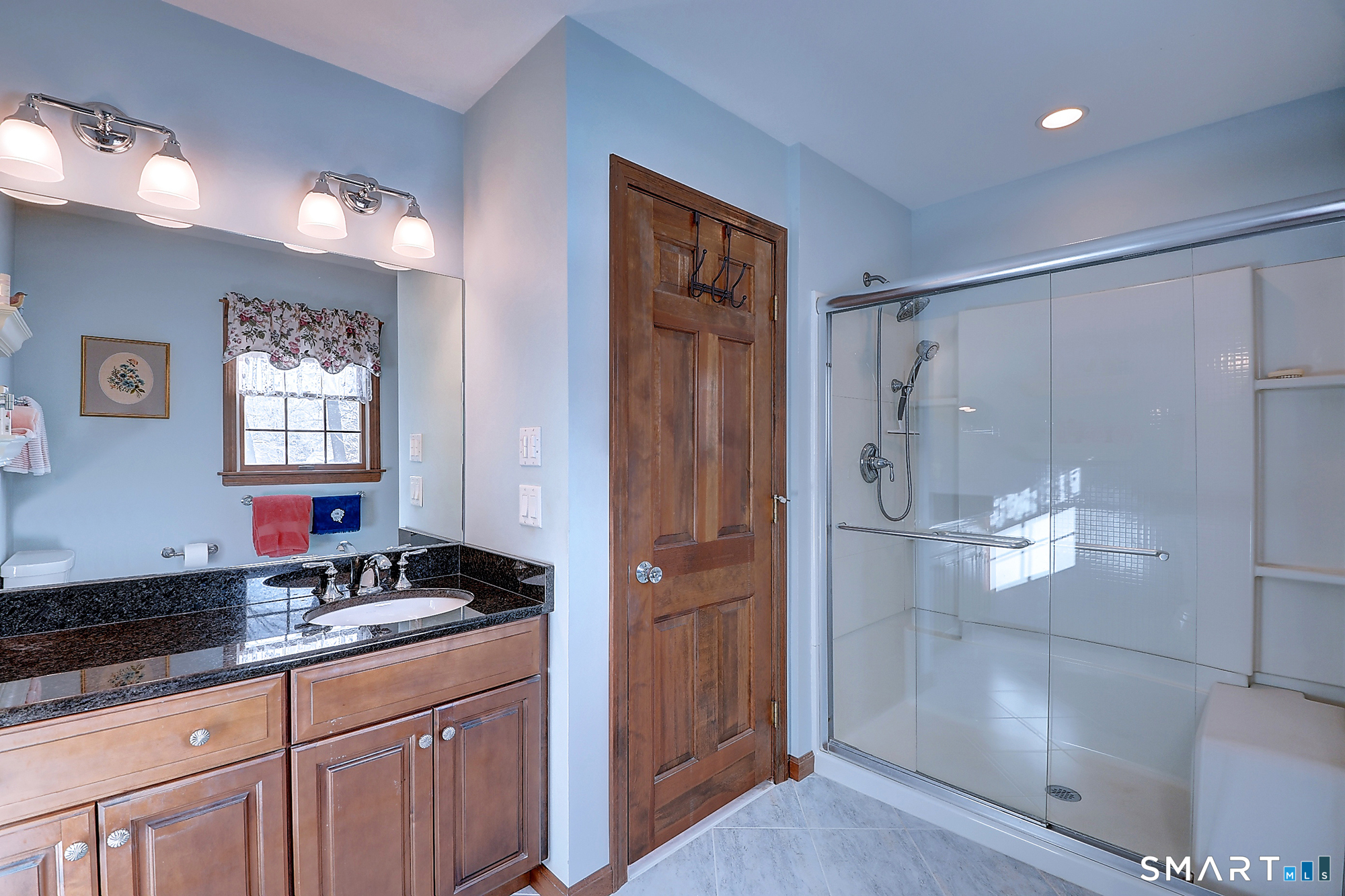 48 Devonshire Drive South Windsor, CT 06074 - Photo 28 of 35 a bathroom with a granite countertop sink a mirror a shower and a bathtub