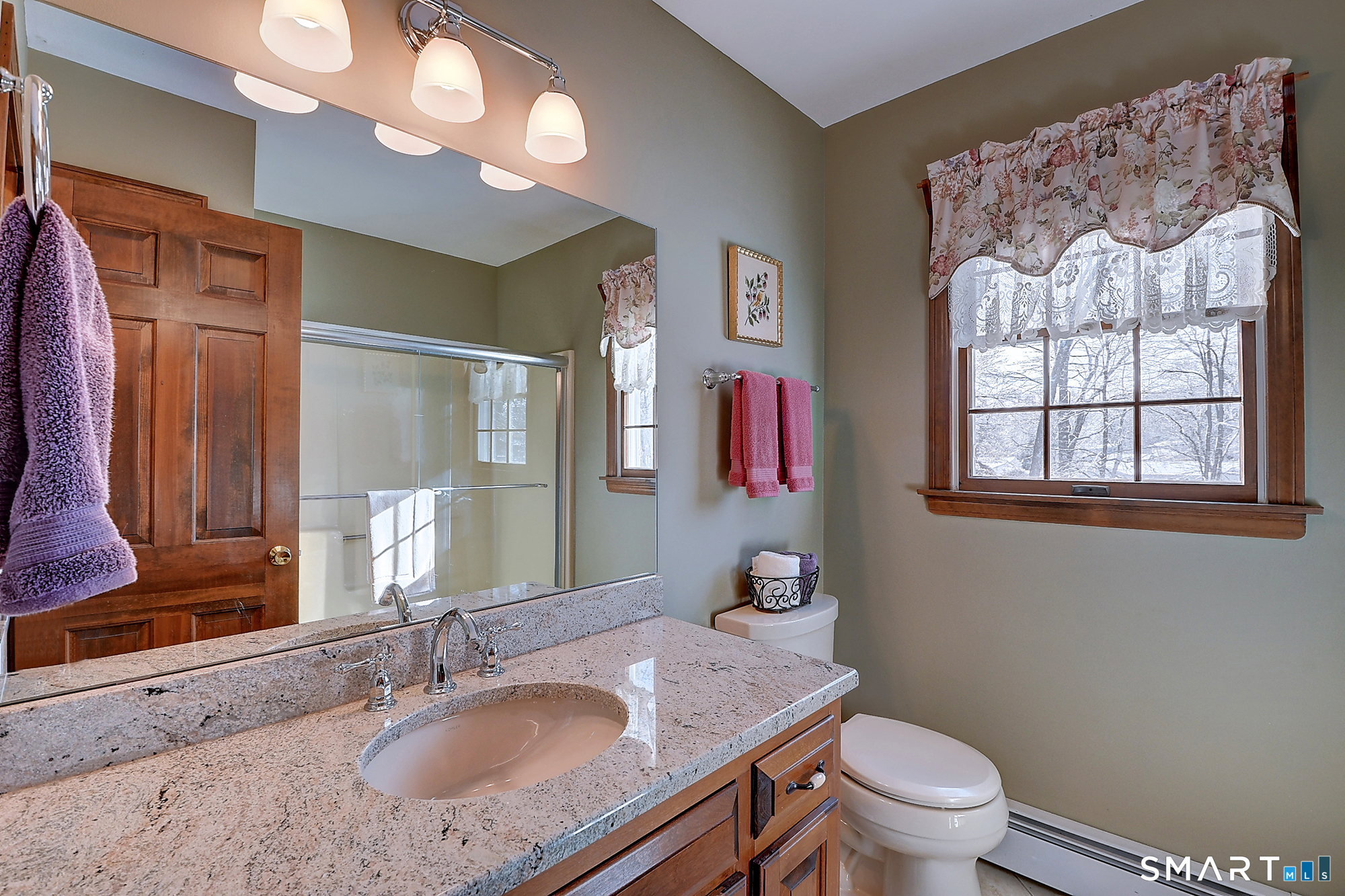48 Devonshire Drive South Windsor, CT 06074 - Photo 29 of 35 a bathroom with a granite countertop toilet a sink and a mirror