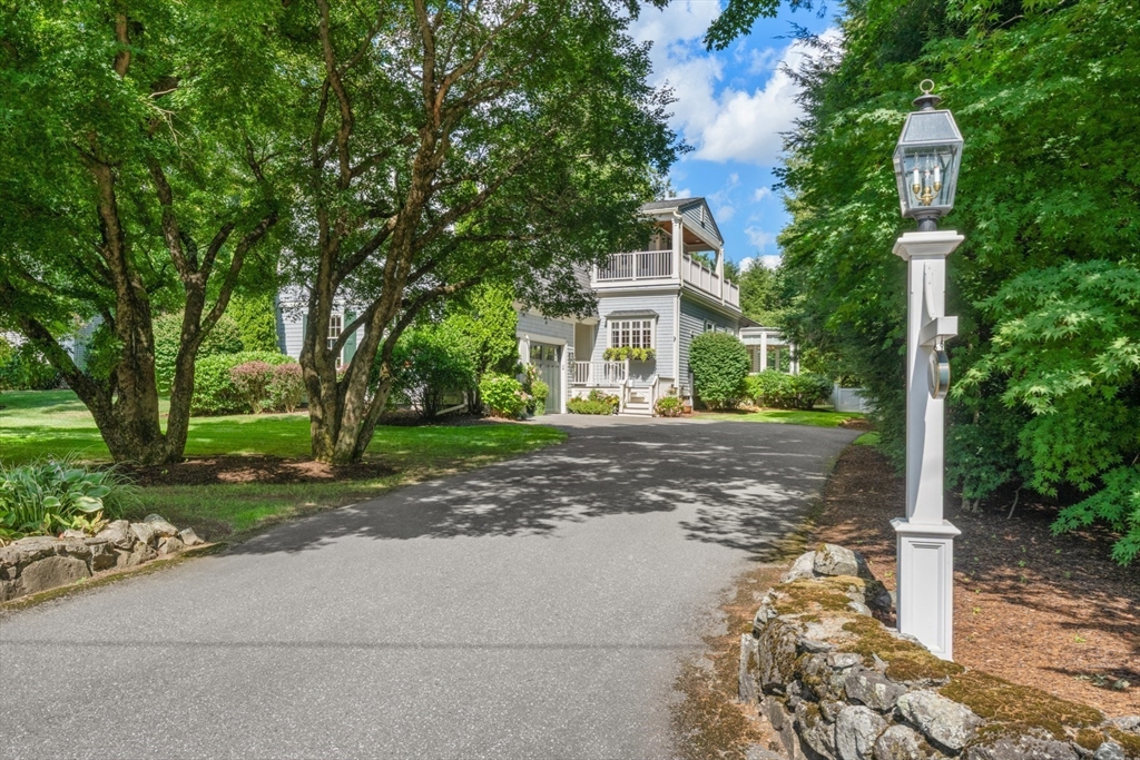 a view of a house with a tree in the background