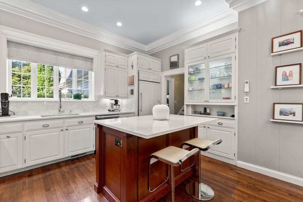 10 Cartwright Road Wellesley, MA 02482 - Photo 11 of 42 a kitchen with a sink cabinets and wooden floor
