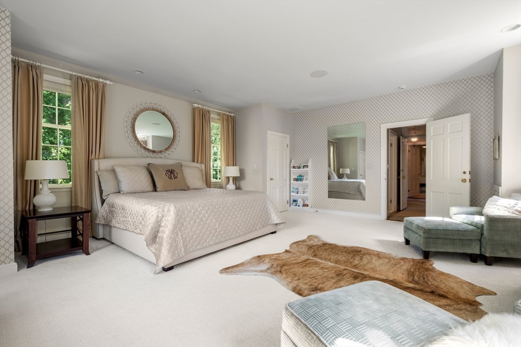 10 Cartwright Road Wellesley, MA 02482 - Photo 22 of 42 a bedroom with a large bed and a couch