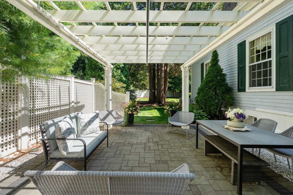 10 Cartwright Road Wellesley, MA 02482 - Photo 36 of 42 a view of a patio with couches table and chairs and potted plants