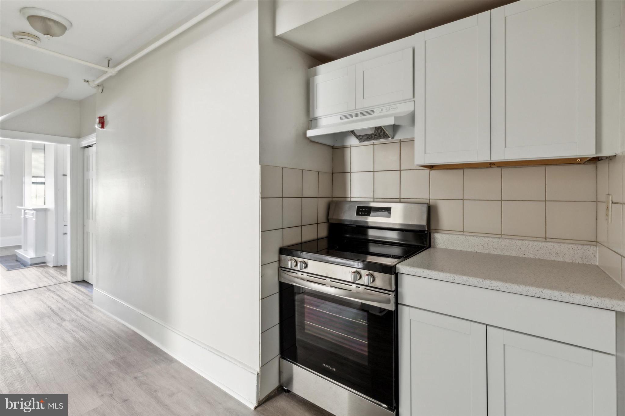 20 South Village Avenue, Unit 3 Exton, PA 19341 - Photo 6 of 17 a kitchen with white cabinets and appliances