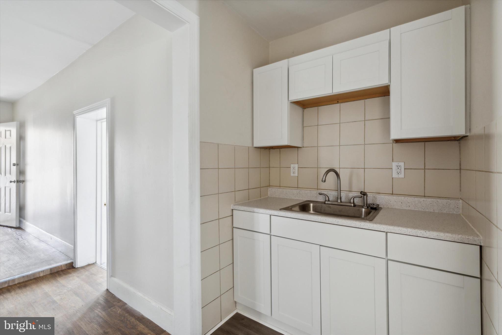 20 South Village Avenue, Unit 3 Exton, PA 19341 - Photo 7 of 17 a kitchen with a sink and cabinets