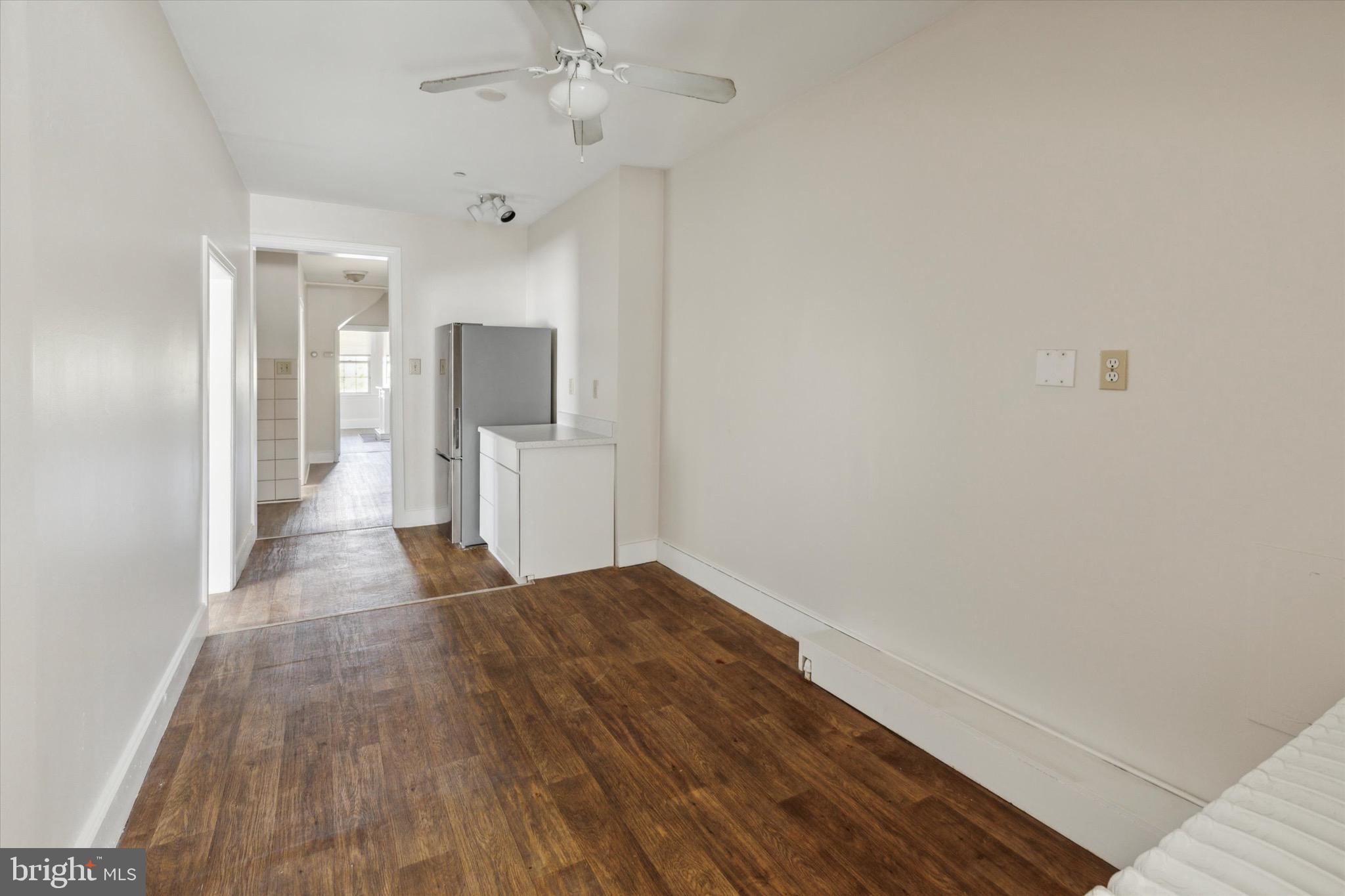20 South Village Avenue, Unit 3 Exton, PA 19341 - Photo 10 of 17 a view of a hallway with wooden floor and chandelier