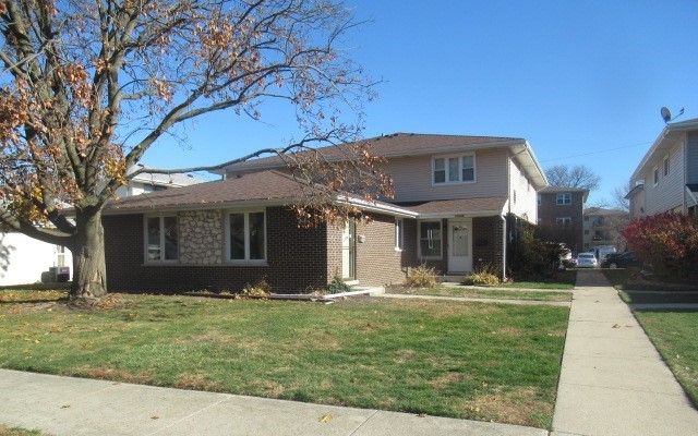 a front view of house with yard