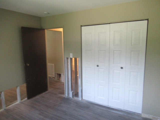 10429 Austin Avenue, Unit A Oak Lawn, IL 60453 - Photo 11 of 16 a view of an empty room with wooden floor and closet