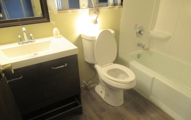 10429 Austin Avenue, Unit A Oak Lawn, IL 60453 - Photo 12 of 16 a bathroom with a toilet sink and mirror