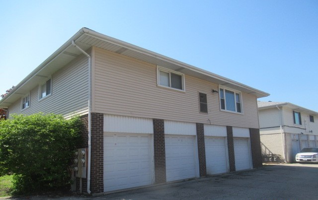 10429 Austin Avenue, Unit A Oak Lawn, IL 60453 - Photo 16 of 16 a front view of a house with a garage