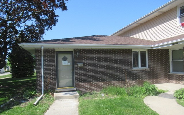 10429 Austin Avenue, Unit A Oak Lawn, IL 60453 - Photo 2 of 16 a front view of a house with garden