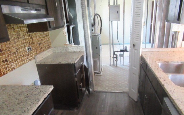 10429 Austin Avenue, Unit A Oak Lawn, IL 60453 - Photo 4 of 16 a en suite bathroom with a granite countertop sink and a mirror
