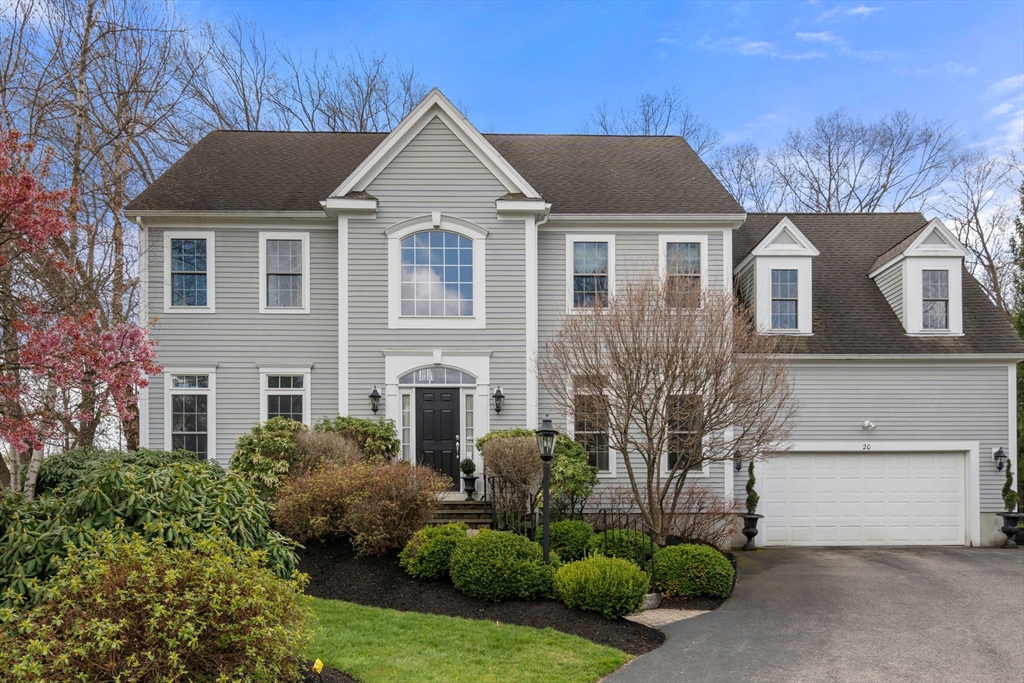 20 Rons Way Framingham, MA 01701 - Photo 1 of 41 a front view of a house with a yard and garage
