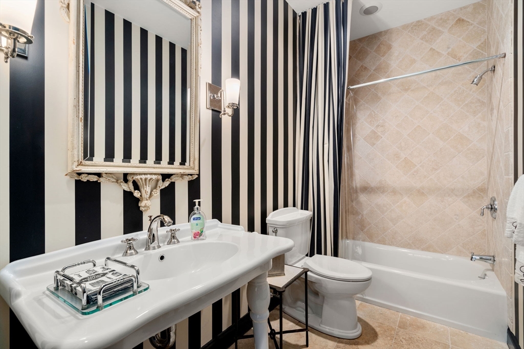 20 Rons Way Framingham, MA 01701 - Photo 21 of 41 a bathroom with a sink and a mirror