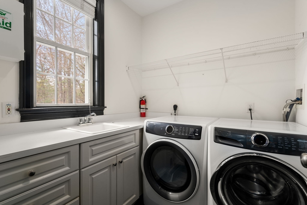 20 Rons Way Framingham, MA 01701 - Photo 23 of 41 a view of a sink and washer dryer