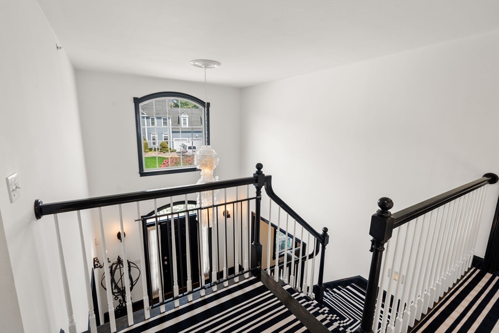 20 Rons Way Framingham, MA 01701 - Photo 24 of 41 a view of staircase with wooden floor and windows