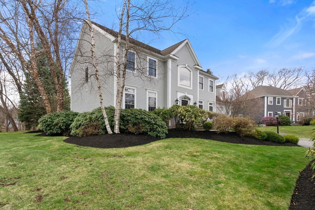 20 Rons Way Framingham, MA 01701 - Photo 3 of 41 a front view of a house with garden