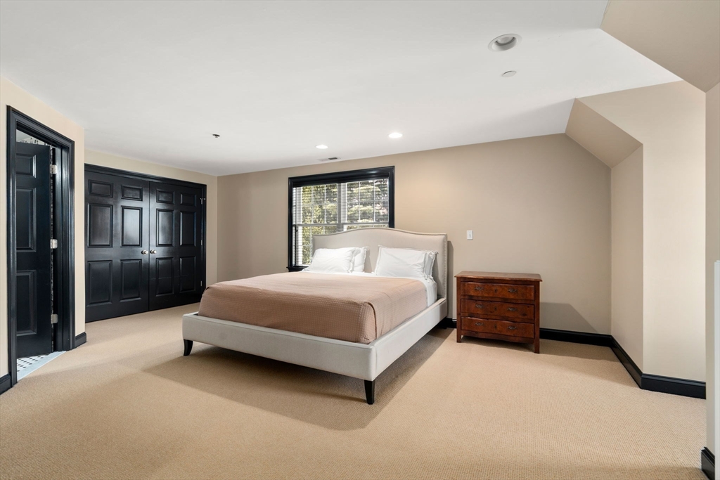 20 Rons Way Framingham, MA 01701 - Photo 32 of 41 a spacious bedroom with a bed and a night stand