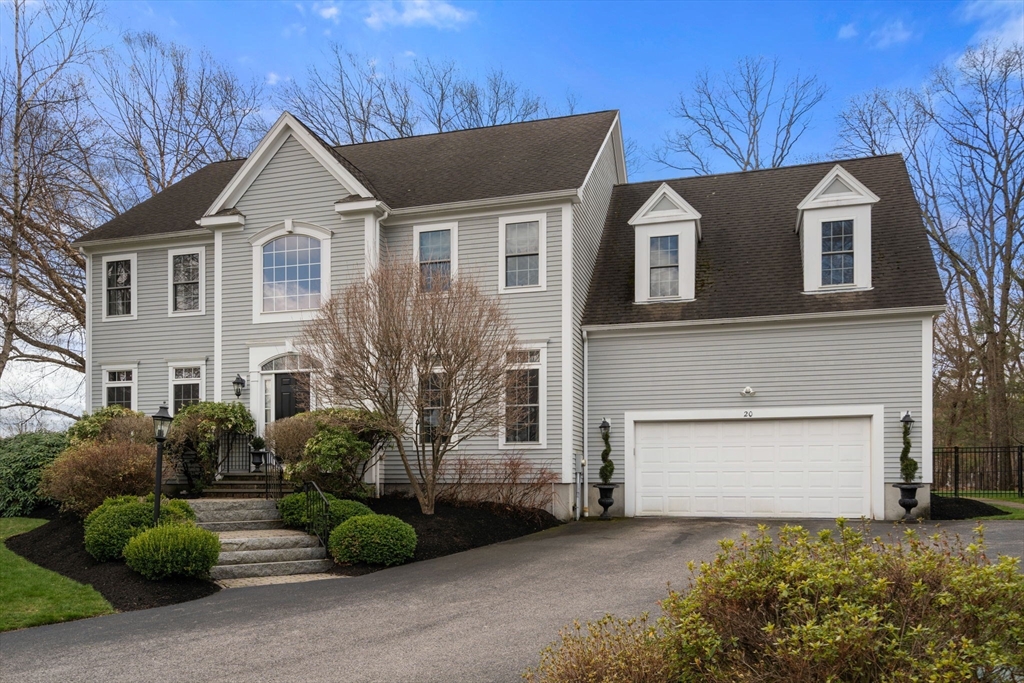 20 Rons Way Framingham, MA 01701 - Photo 4 of 41 a front view of a house with a yard and garage