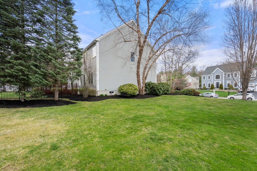 20 Rons Way Framingham, MA 01701 - Photo 41 of 41 a view of a backyard with large trees