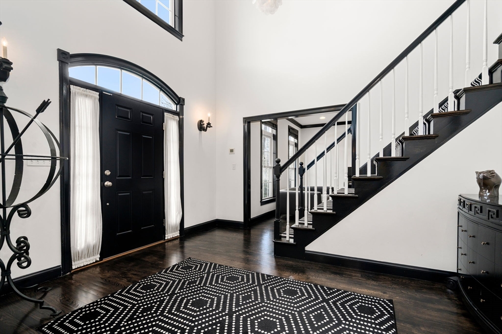 20 Rons Way Framingham, MA 01701 - Photo 5 of 41 a view of staircase with wooden floor and a rug