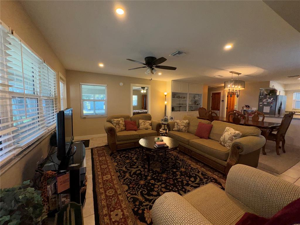 1893 North Lake Reedy Boulevard Frostproof, FL 33843 - Photo 11 of 56 a living room with furniture and a large window