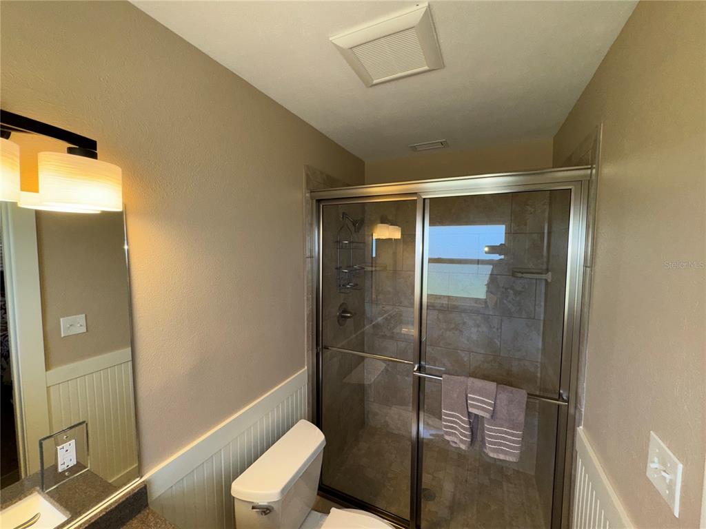 1893 North Lake Reedy Boulevard Frostproof, FL 33843 - Photo 22 of 56 a bathroom with a shower and toilet