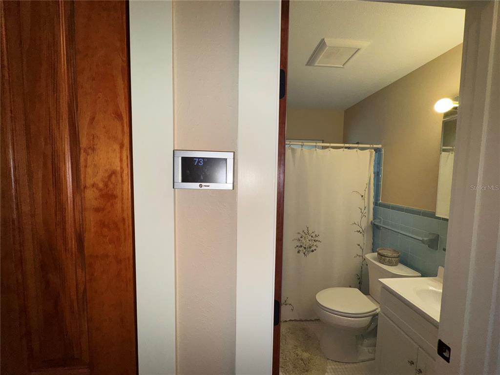 1893 North Lake Reedy Boulevard Frostproof, FL 33843 - Photo 27 of 56 a bathroom with a toilet a sink and shower