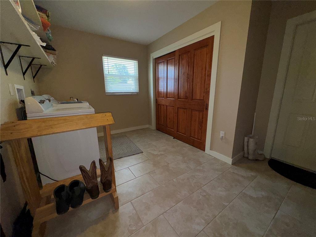 1893 North Lake Reedy Boulevard Frostproof, FL 33843 - Photo 29 of 56 a view of a storage & utility room with washer and dryer