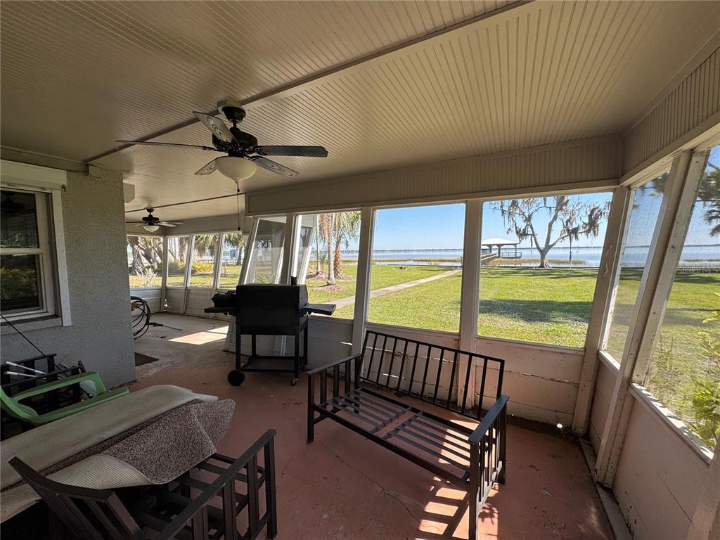 1893 North Lake Reedy Boulevard Frostproof, FL 33843 - Photo 38 of 56 a living room with furniture and a large window