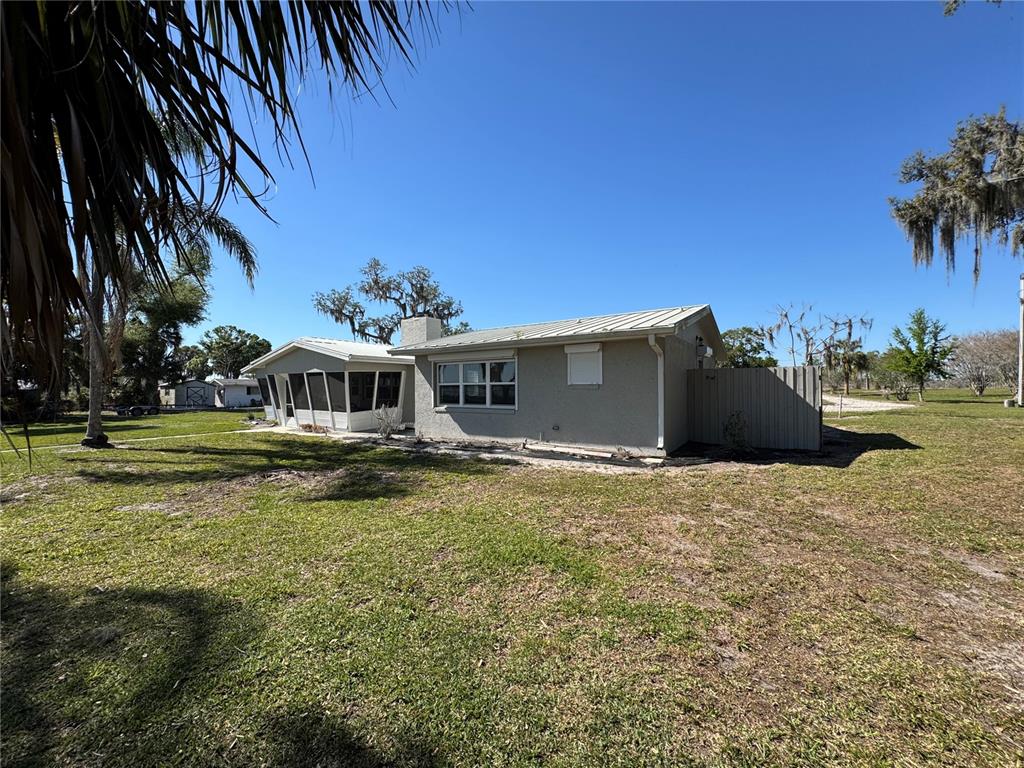 1893 North Lake Reedy Boulevard Frostproof, FL 33843 - Photo 41 of 56 a front view of a house with garden