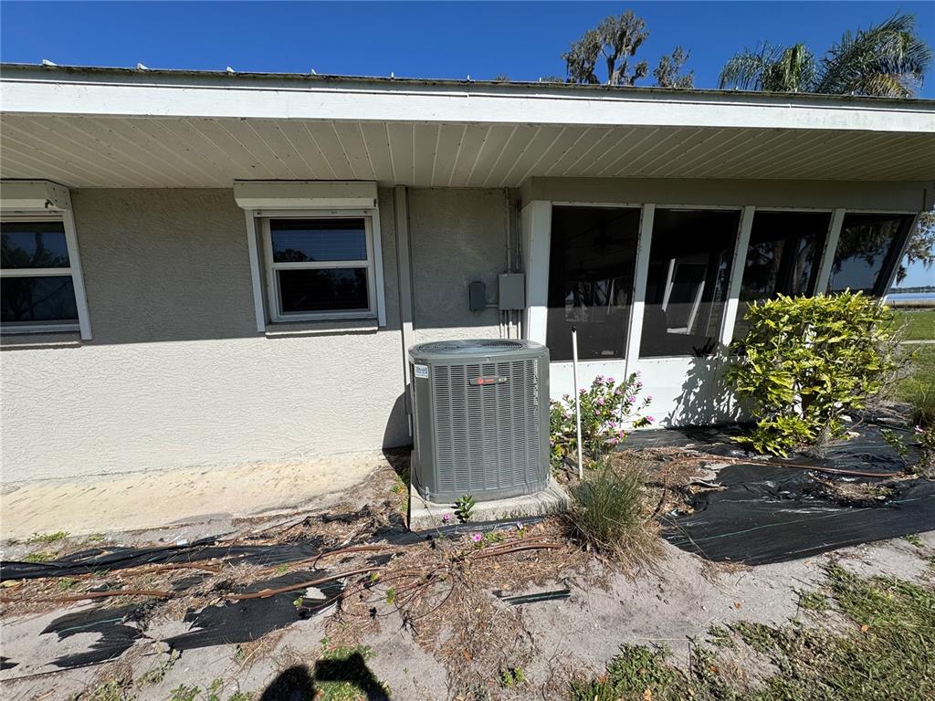 1893 North Lake Reedy Boulevard Frostproof, FL 33843 - Photo 43 of 56 a view of a house with backyard and sitting area