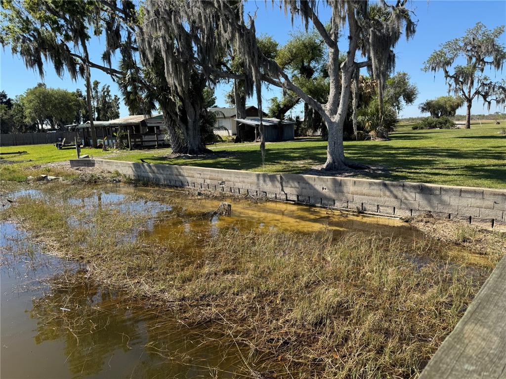 1893 North Lake Reedy Boulevard Frostproof, FL 33843 - Photo 48 of 56 a view of a swimming pool with a garden