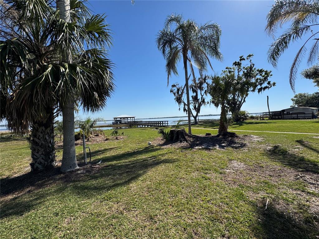 1893 North Lake Reedy Boulevard Frostproof, FL 33843 - Photo 55 of 56 a view of a swimming pool and trees