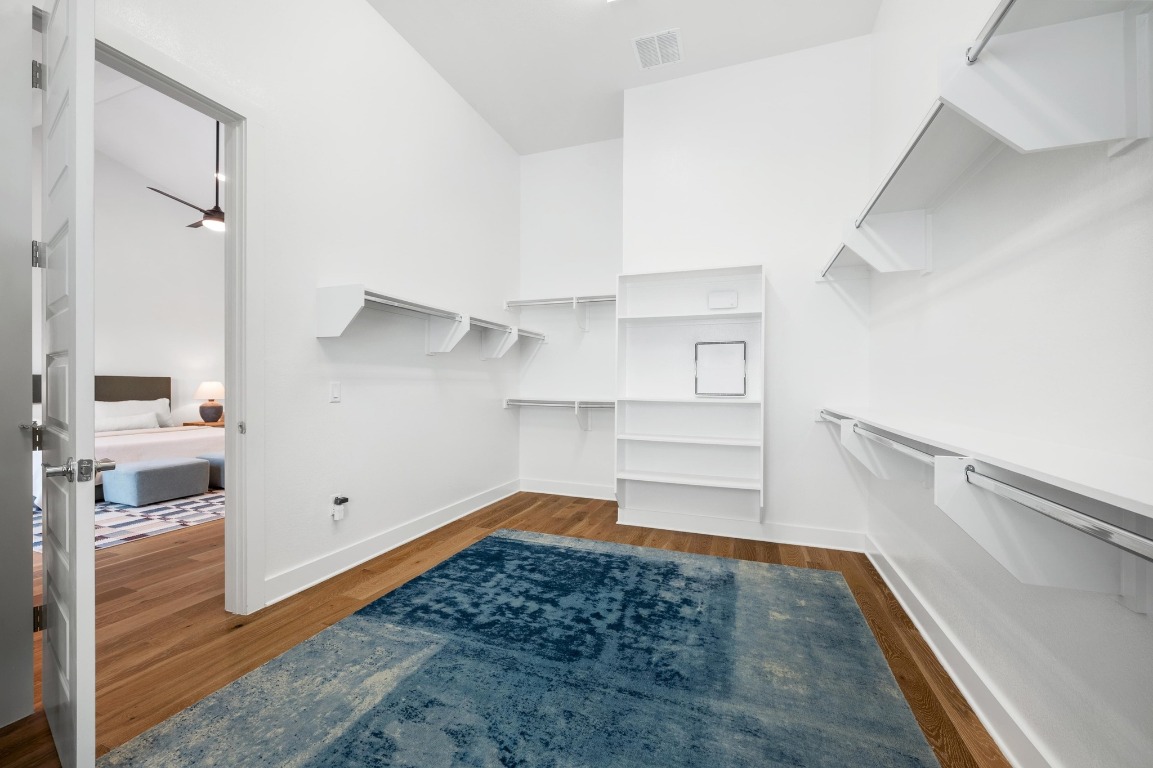 5428 Agatha Circle Austin, TX 78724 - Photo 17 of 40 a view of walk in closet with clothes and shoes