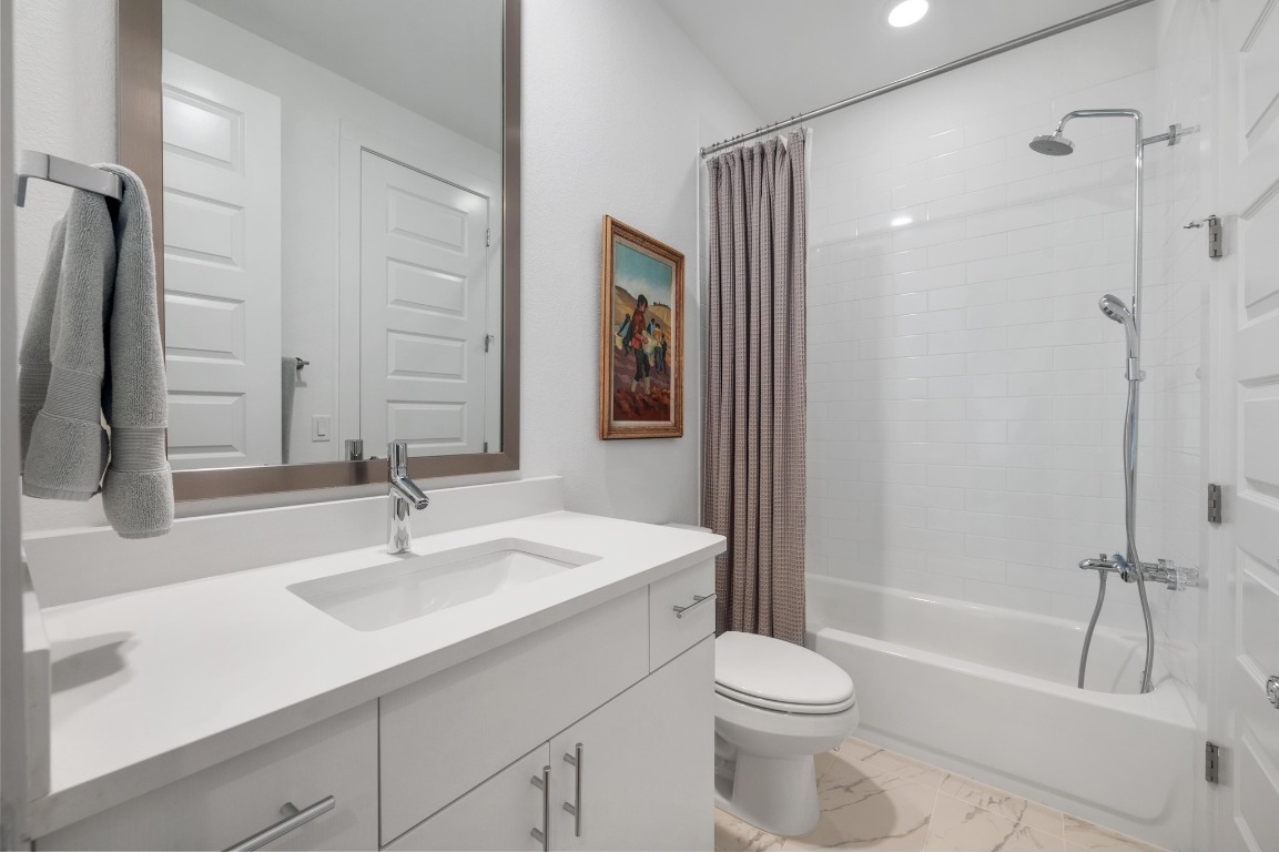 5428 Agatha Circle Austin, TX 78724 - Photo 23 of 40 a bathroom with a sink toilet and shower