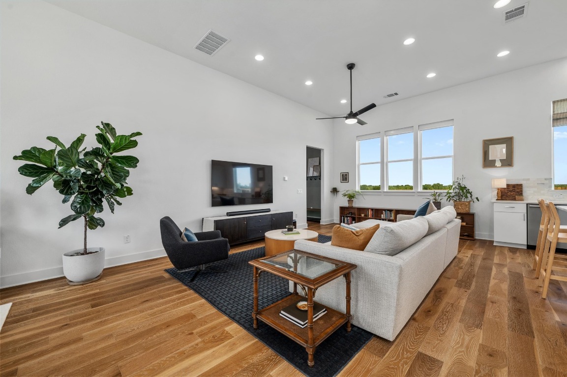 5428 Agatha Circle Austin, TX 78724 - Photo 6 of 40 a living room with furniture potted plant and a flat screen tv