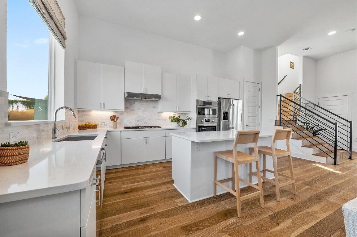 5428 Agatha Circle Austin, TX 78724 - Photo 8 of 40 a kitchen with a sink cabinets and window