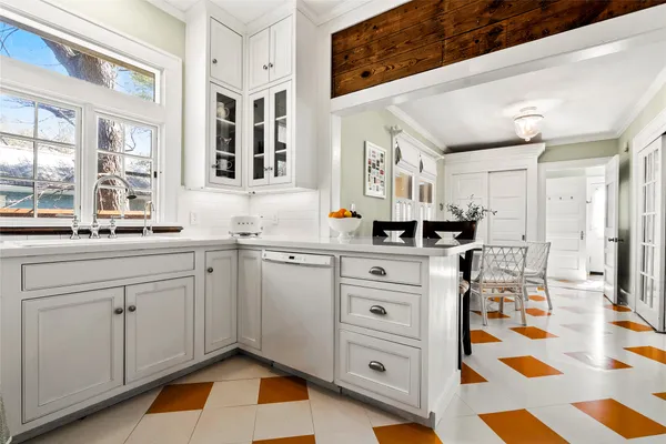a kitchen with a cabinets and window