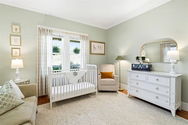 a bedroom with bed and window
