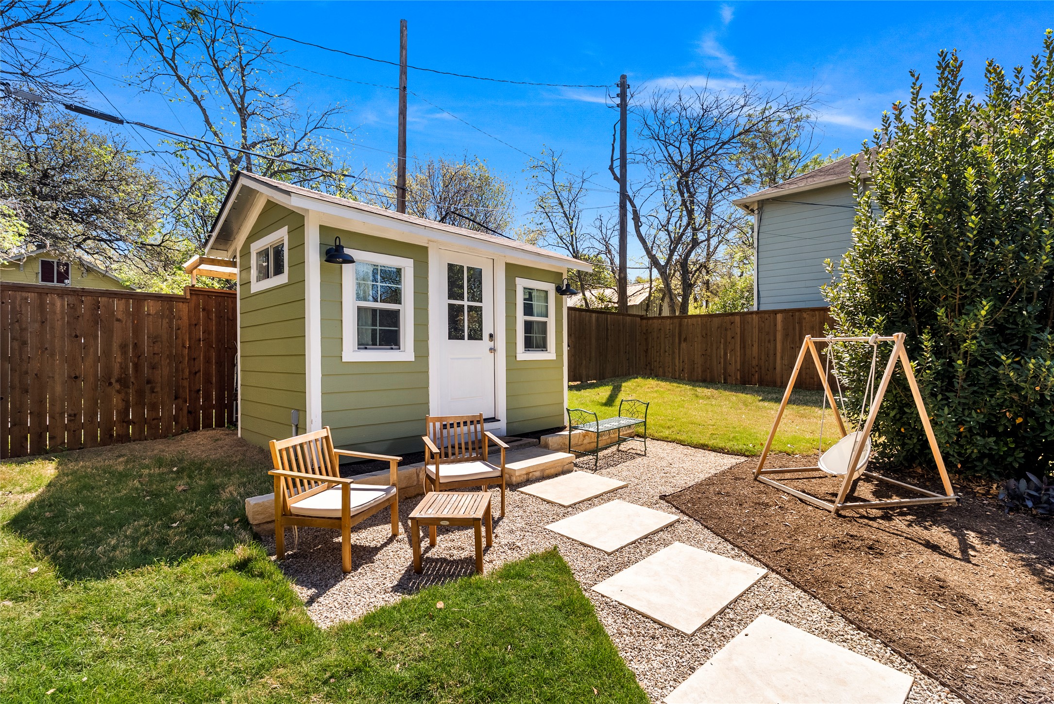1809 Nickerson Street Austin, TX 78704 - Photo 26 of 31 a view of a lounge chairs in the back yard of a house