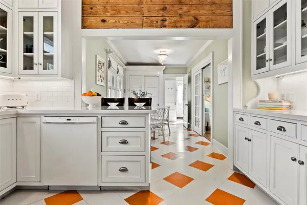 a bathroom with a sink a mirror and a shower