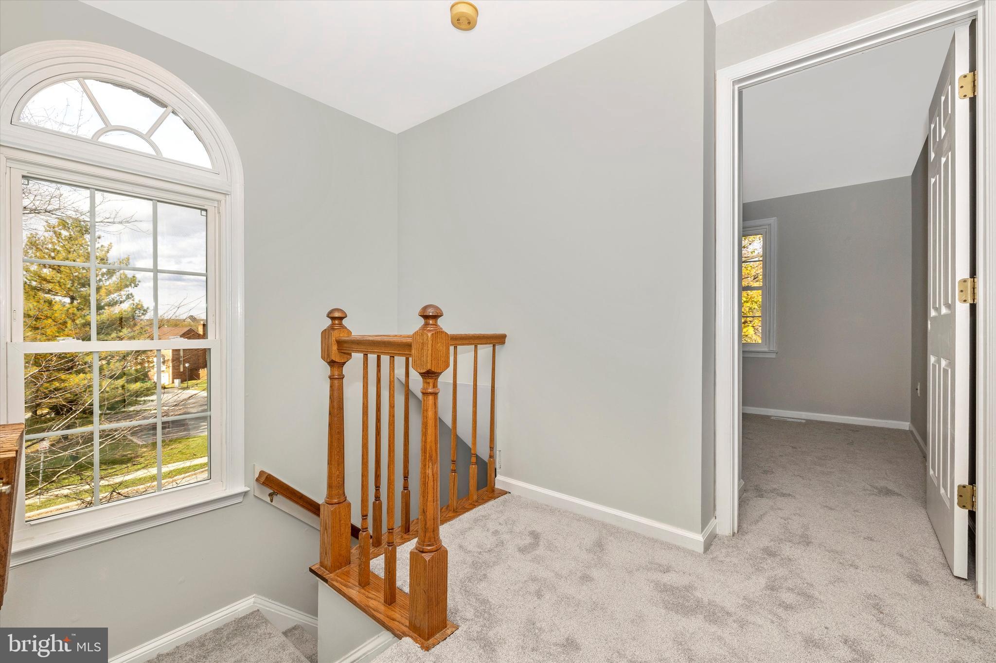 8001 Hollow Reed Court Frederick, MD 21701 - Photo 18 of 33 an entryway with a door and wooden floor